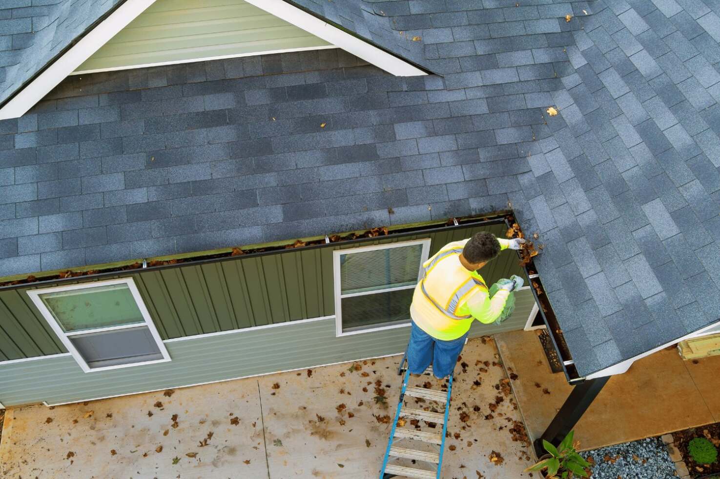 An illustration of a professional roofing contractor performing maintenance on a roof.