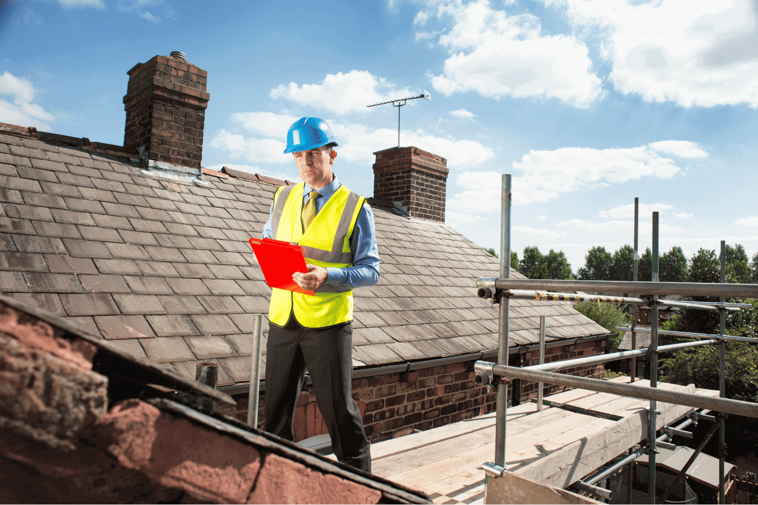 A professional roofer assessing a roof for potential shingle replacement