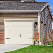 A comparative image showing vinyl siding next to wood and metal siding.