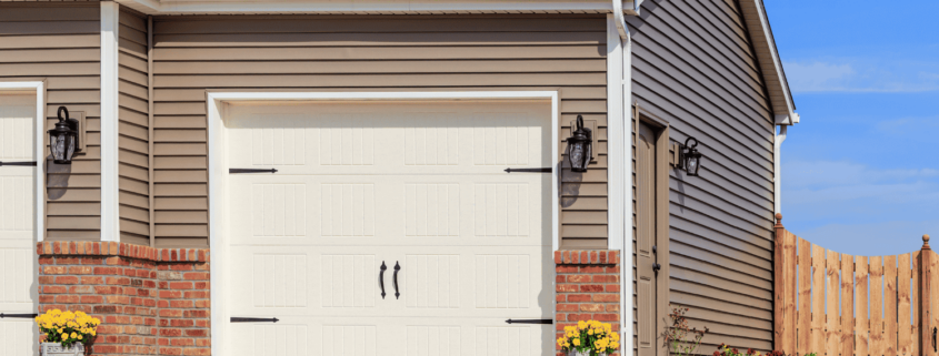 A comparative image showing vinyl siding next to wood and metal siding.