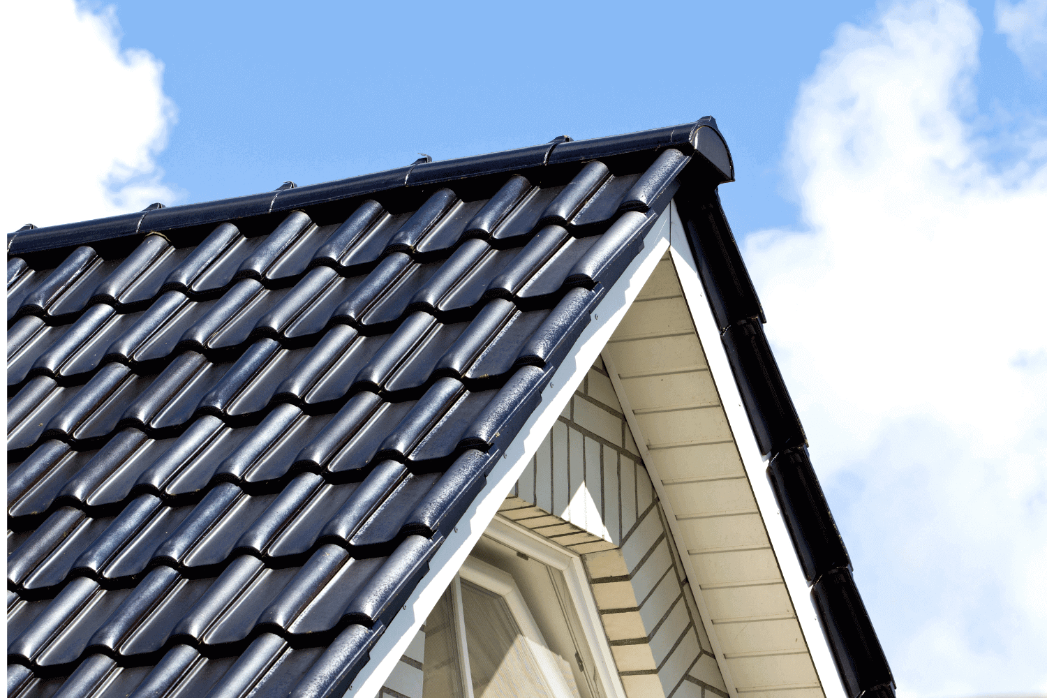 A person performing a DIY repair on roof flashing, demonstrating the use of roofing cement.