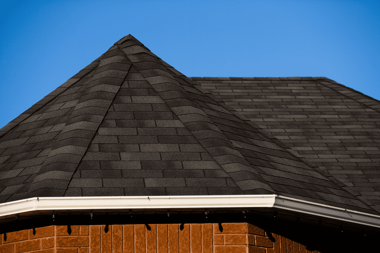 Factors influencing roofing costs including roof size and pitch.