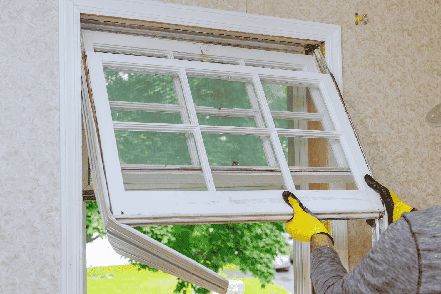 A house with old, worn-out windows indicating the need for window replacement..