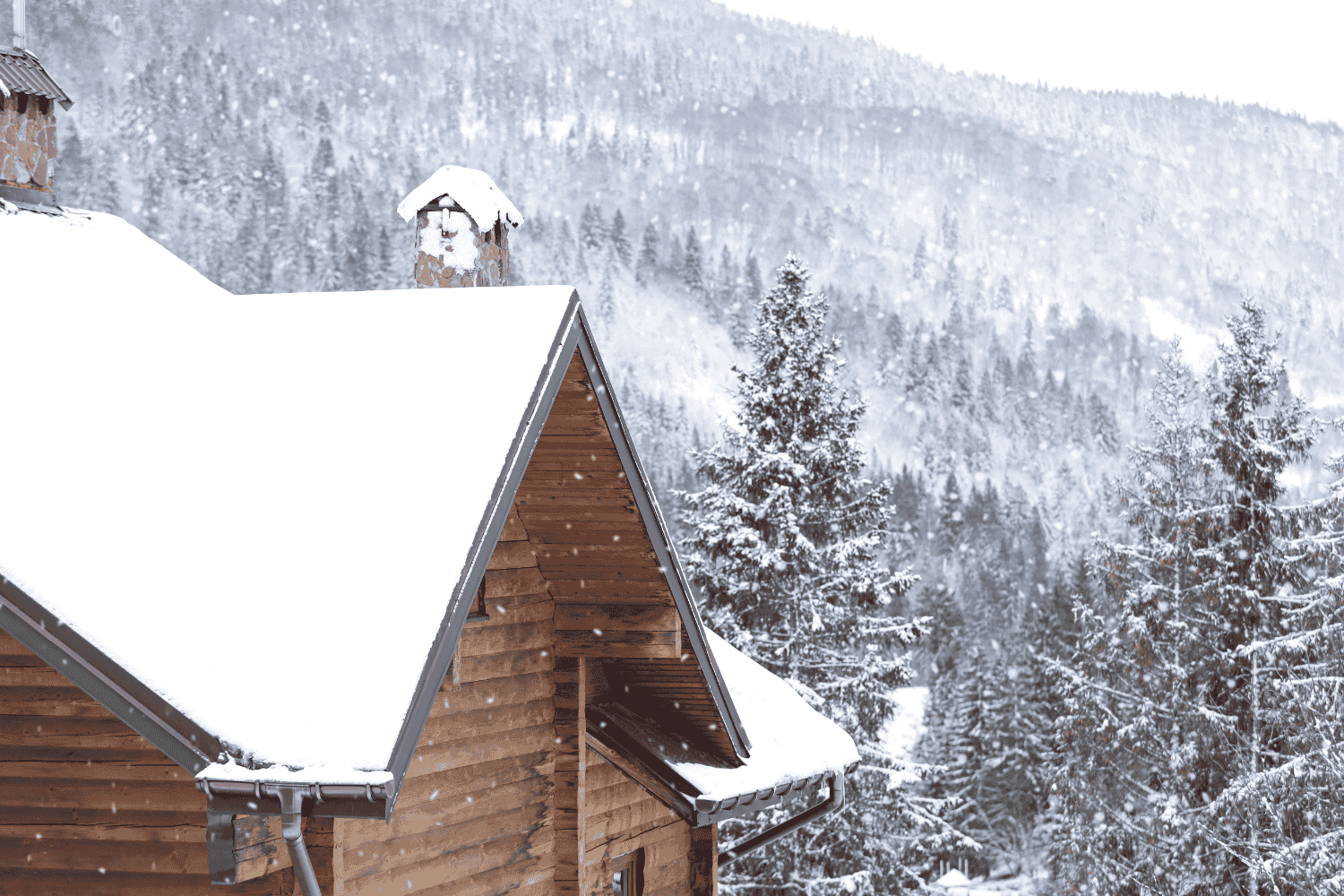 A roofing crew working on a roof replacement during winter conditions.