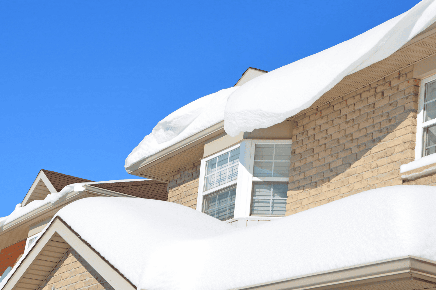 A winter roof showcasing a new installation with snow on top.