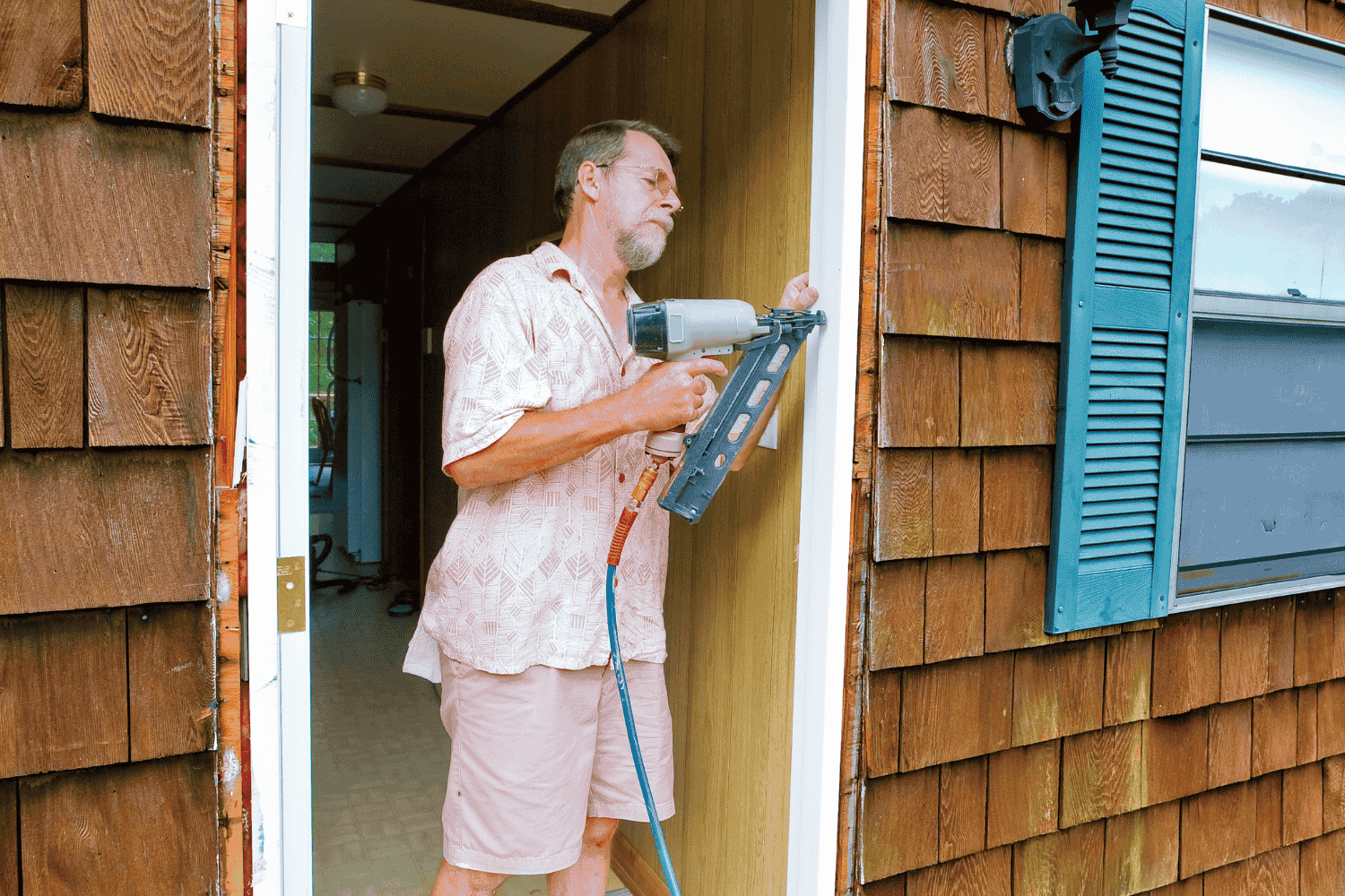 Preparing a new door for installation, showcasing the tools and materials needed.