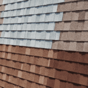 A variety of asphalt shingles displayed in different colors and styles, showcasing the popular choice for roofing.