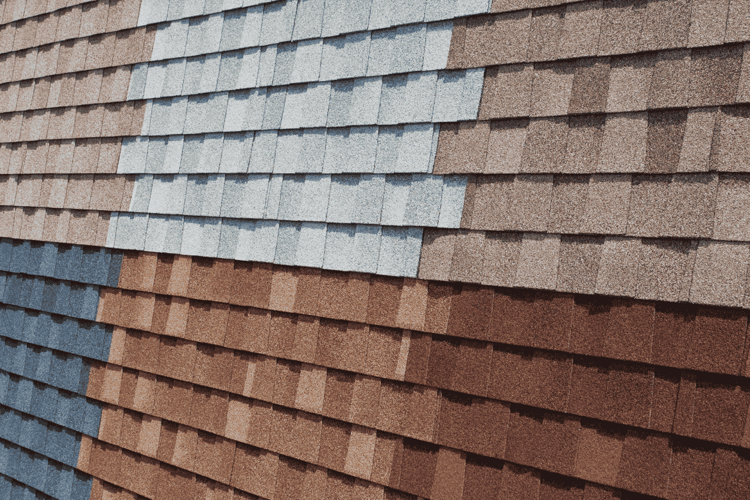 A variety of asphalt shingles displayed in different colors and styles, showcasing the popular choice for roofing.